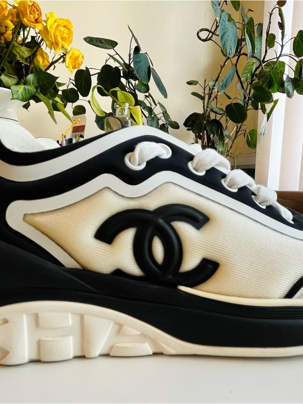 CHANEL White and Black CC Logo Runner Sneaker